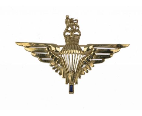 A PARACHUTE REGIMENT GOLD SWEETHEART BROOCH  set with a step cut sapphire, marked 9ct ++Some signs of wear but complete, gros