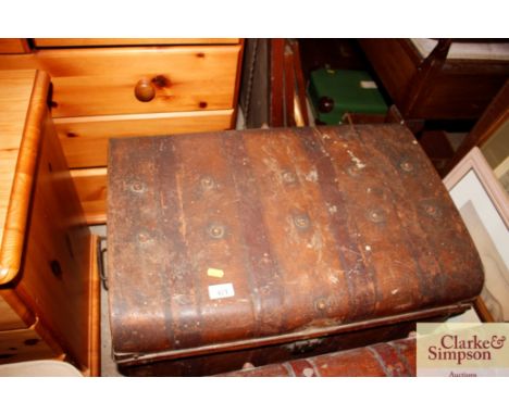 A japanned metal trunk 