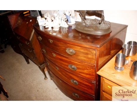 A Georgian mahogany bow fronted chest of four long graduated drawers 