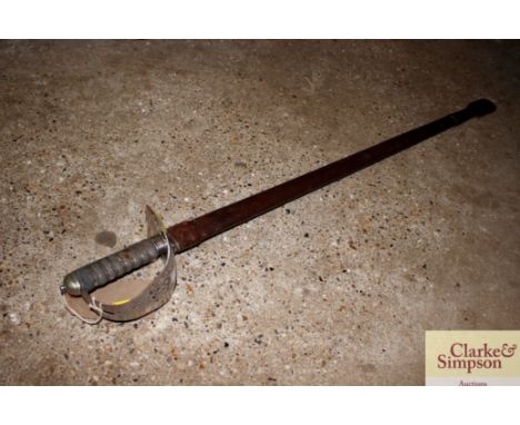 A George V 1897 patent sword in leather scabbard 