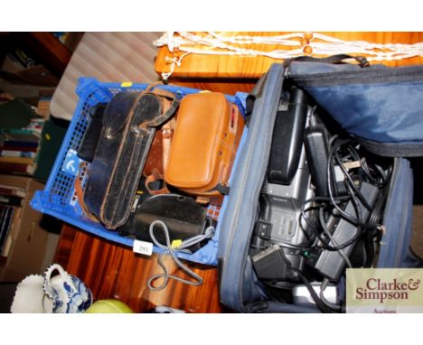 A cased video camera and a quantity of various other cameras etc.