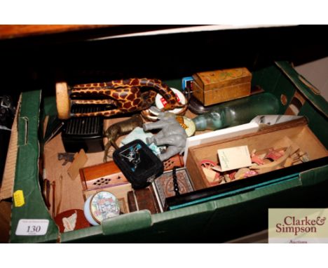 A box containing various animal ornaments, trinket boxes, cigarette case, vintage glass bottle, brass stag ornament etc.