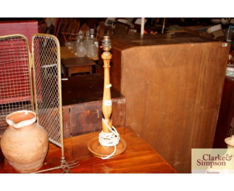 A turned wooden table lamp 