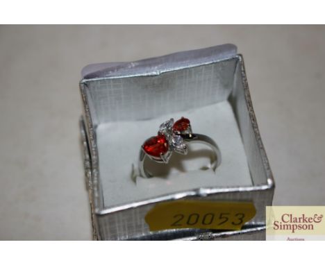 A 925 pink, red and white stone heart shaped cross over ring 