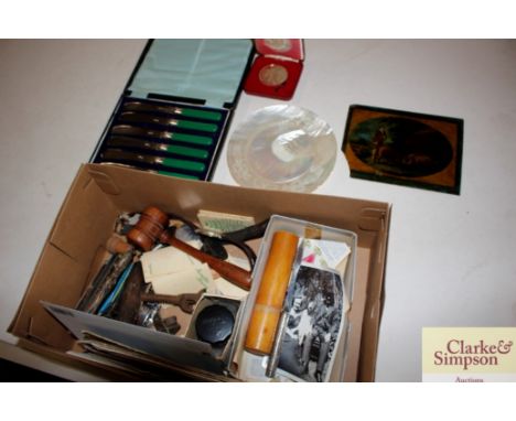 A box of miscellaneous items to include a corkscrew, gavel, various ephemera, mother of pearl dish, a cased set of tea knives