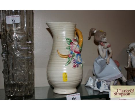 A Clarice Cliff floral pattern baluster jug