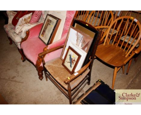 An early 20th Century ladder back chair with rush seat 