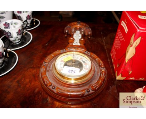 A small carved walnut banjo shaped barometer thermometer