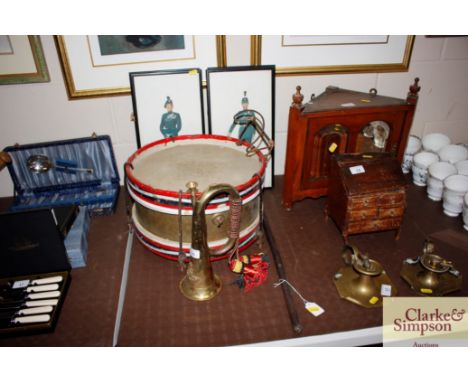 A vintage military drum; a Royal Artillery bugle, various prints of soldiers in uniform, and an Officers leather covered cane