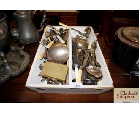 A painted wooden cutlery tray and contents of various plated cutlery to include a soup ladle 