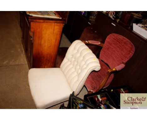 A Victorian walnut framed button back nursing chair; a pink upholstered elbow chair; and a brown upholstered chair 