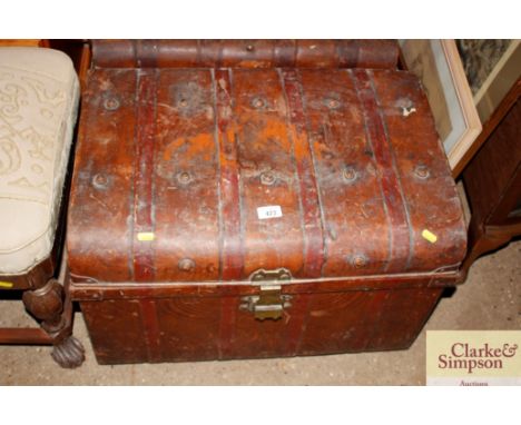 A large japanned metal trunk 