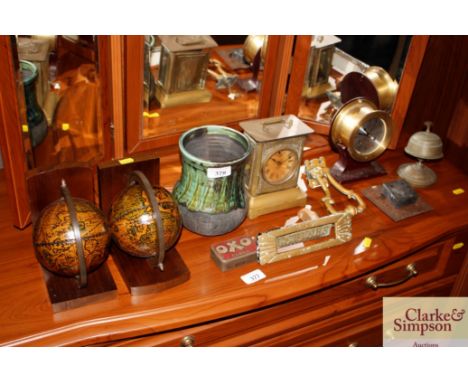 A Studio Pottery baluster vase; a pair of Globe bookends; a brass cased mantel clock; a brass cased ship style clock; a brass