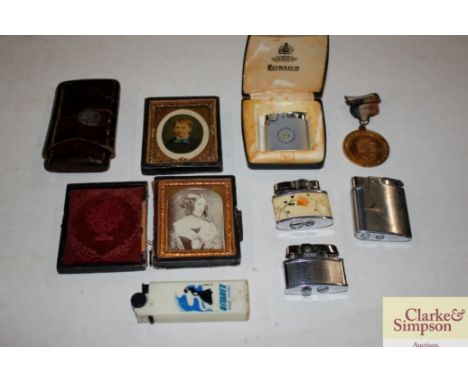 A lighter, cigar case, photos etc.