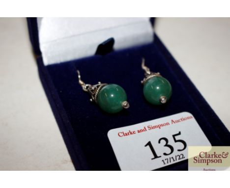 A pair of .925 and jade type pendant ear-rings