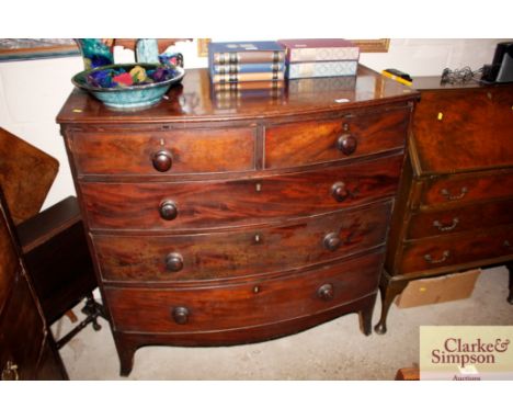 A Georgian mahogany bow fronted chest of two short and three long drawers