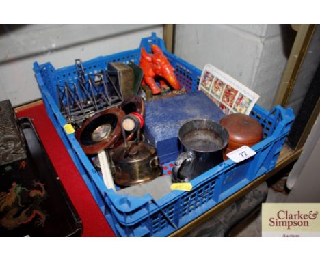 A shallow tray and contents containing an Art Deco plated toast rack; a plated tankard; an orange elephant ornament; various 