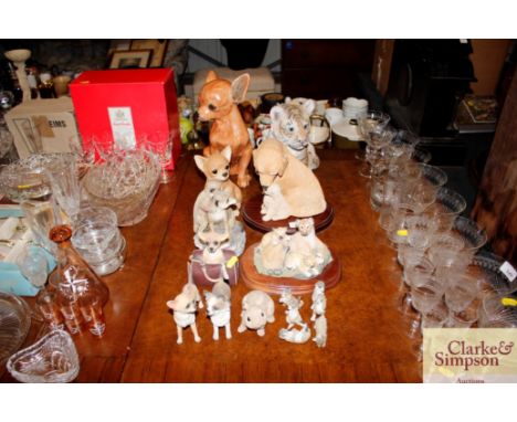 A collection of various ceramic dogs and other animal figure groups