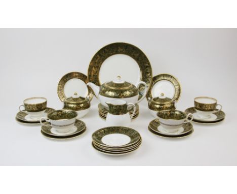 A Wedgwood 'Florentine' part tea service, comprising: a teapot and cover, a milk jug, two sucriers, twelve tea cups, seven co