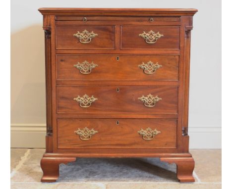 A George III style mahogany bachelors chest, the rectangular thumb moulded top above a baize lined brushing slide, over two s
