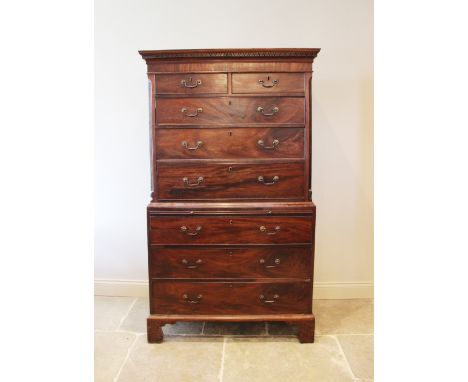 A George III mahogany chest on chest, the moulded cornice with a Greek key pattern frieze over two short and three long oak l
