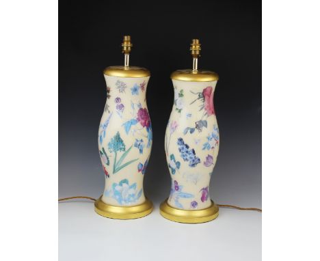 A pair of decoupage effect table lamps, probably Vaughan of Chelsea, of baluster form with turned gilt wood foot and cap, eac