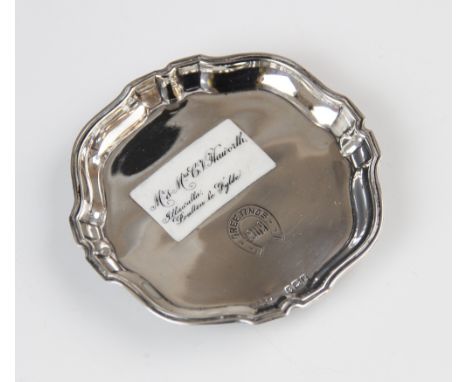 An Edwardian silver and enamel pin tray, marks for Russells Ltd, Birmingham 1909, with Chippendale border on four scroll feet