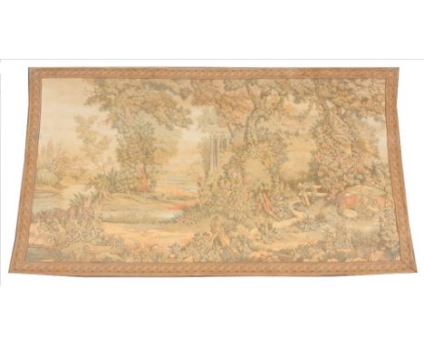 An early 20th century French machine woven tapestry, depicting architectural columns in a tree lined landscape, within a spir