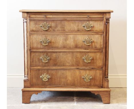 A George III style mahogany bachelors chest, the rectangular thumb moulded top above a baize inset brushing slide, over four 