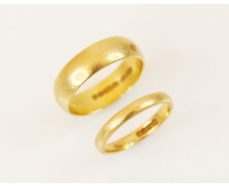 A 22ct gold wedding band, marks for Birmingham 1978, ring size K, together with a further example dated Birmingham 1938 (at f