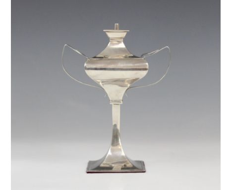 A George V silver table lighter by Charles Boyton & Son Ltd, London 1912, of faceted form on tapered stem on a weighted sprea