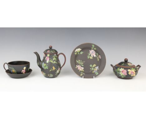 A selection of Wedgwood black basalt tea wares decorated in the 'Chinese Flowers' pattern, 19th century, comprising: a hot wa
