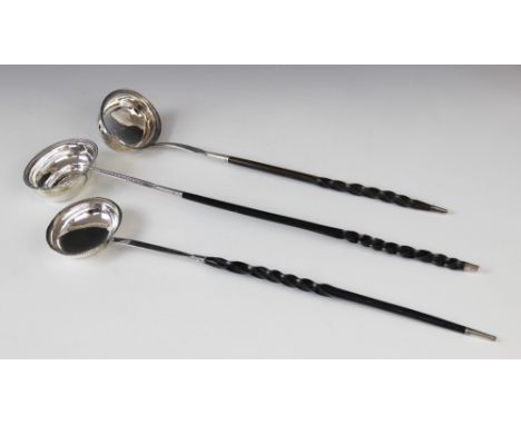 A George III silver toddy ladle, date letter for 1786 (maker's mark and city mark worn) the oval bowl with beaded border, set
