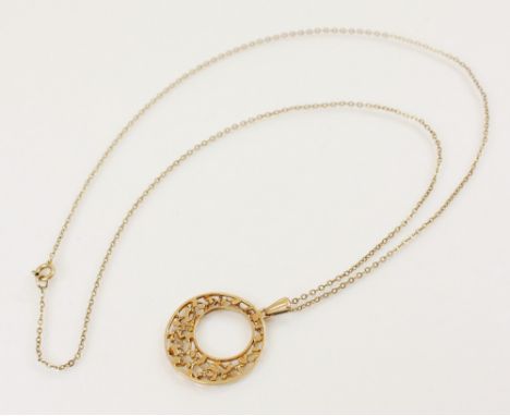 A 9ct gold wreath pendant, designed as a pierced circular stylized wreath, marks for Birmingham 1979, 24mm diameter, set to a