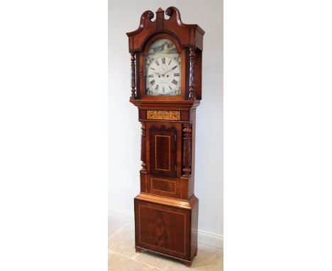 An early 19th century mahogany longcase clock by Heywood, Wrexham, the broken swan neck pediment over acanthus carved freesta