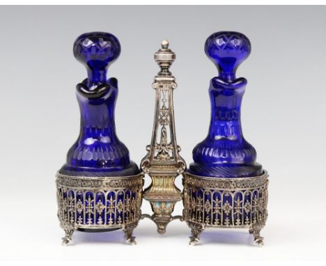 A late 19th century French belle époque oil and vinegar cruet, stamped 'Fray Fils', the oval stands set to columnar shaft, wi