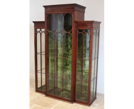 A full height breakfront display cabinet, in the Edwardian style, with three astragal glazed doors and green velvet lined int