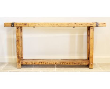 A rustic hardwood and iron bound console table, the slab top applied with rivet detail iron work, upon four legs of square se