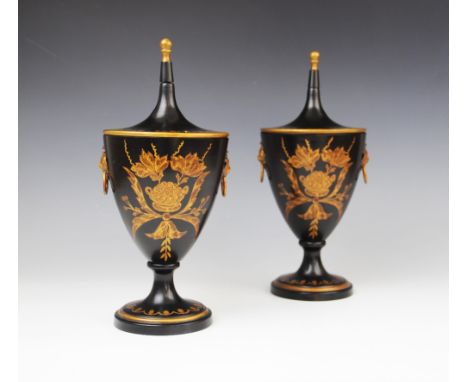 A pair of Regency style Toleware chestnut urns and covers, of goblet form on knopped stem to spreading pedestal foot, with li