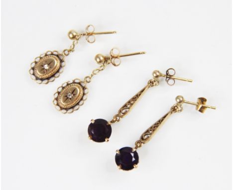 A pair of Victorian style diamond set drop earrings, each comprising a small single cut diamond set to an unmarked yellow met