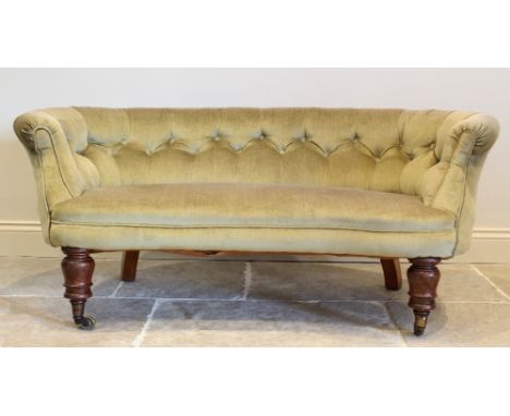 A Victorian kidney shaped Chesterfield type settee of cottage proportions, in green velour fabric, the padded button back enc