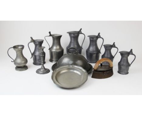 A collection of 19th century and later pewter, comprising: a graduated set of six lidded flagons with twin acorn finials, the
