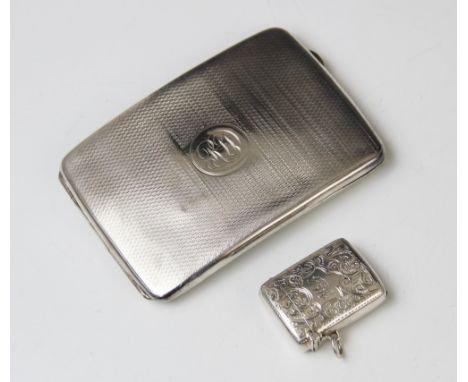 A George V silver cigarette case by Charles S Green & Co Ltd, Birmingham 1919, of rounded rectangular form with all-over engi