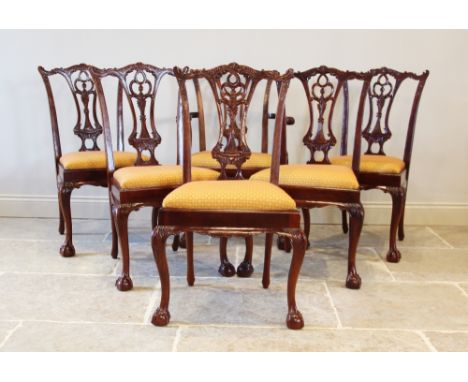 A set of ten Chippendale style mahogany dining chairs, late 20th century, each with an interlaced splat back above a drop in 