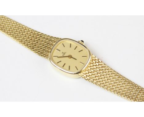 A lady's vintage 18ct gold Ebel wristwatch, the gold-toned dial with black and gold baton markers, set to a plain polished 18