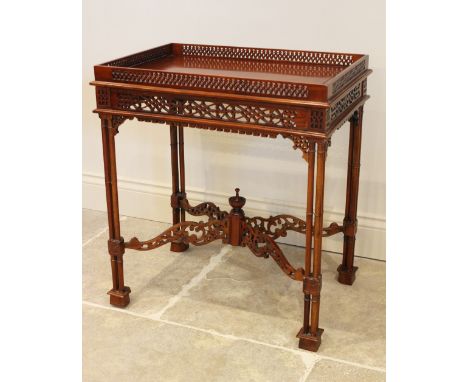 A Chinese Chippendale style mahogany silver table, late 20th century, the rectangular top with a pierced gallery over a confo