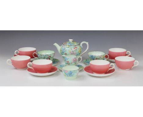 A Shelley tête-à-tête tea service in the 'Melody' pattern, early 20th century, comprising: a teapot and cover, two cups, two 