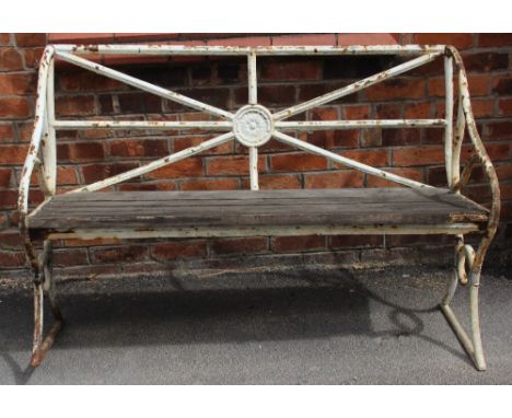 An early 19th century painted iron garden bench, the rail back centred with a cast Lancashire rose roundel, above four hardwo