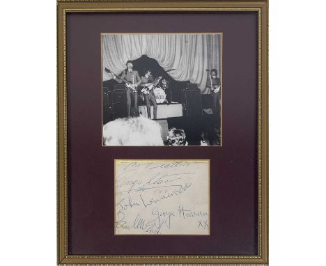A page from an autograph book (trimmed, approx 10x8cm) bearing signatures by John Lennon, George Harrison, Paul McCartney, Ri