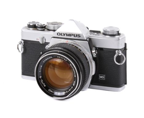 An Olympus OM-1 35mm SLR camera. Chrome. Serial number 1469864. Shutter working. With an Olympus 50mm f1.4 G.Zuiko Auto-S len